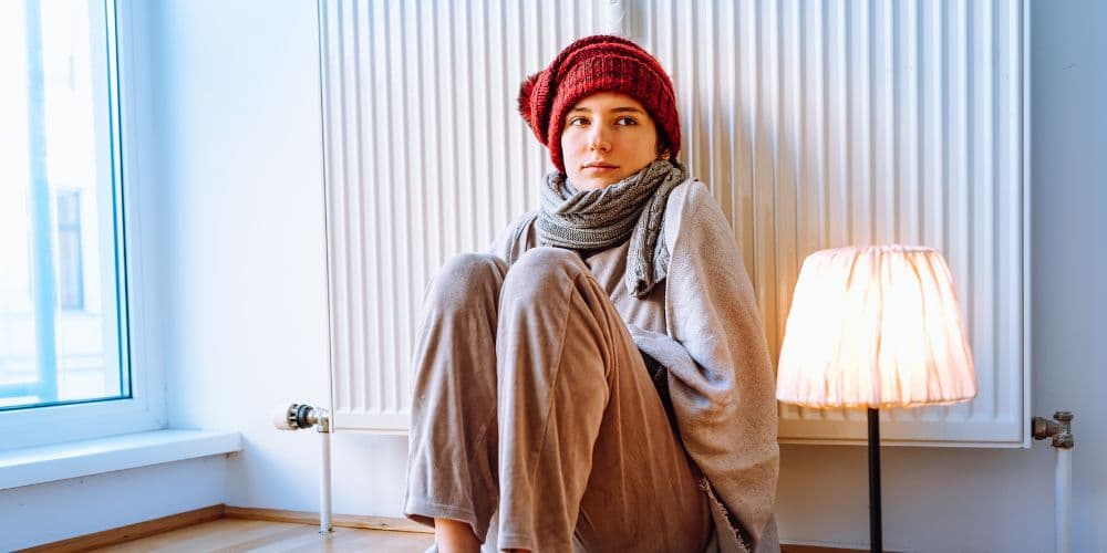 woman-leaning-on-radiator.jpg